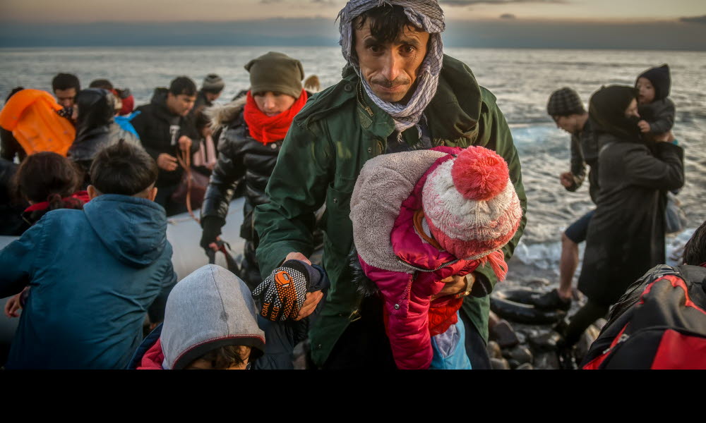 En familie på flukt ankommer den greske øya Lesbos